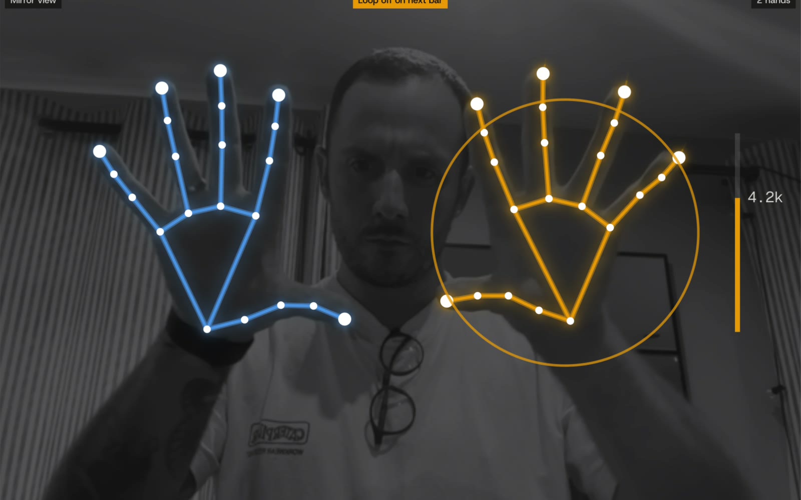 Both hands open, fingers spread wide, opening the reverb with the filter at 4.2 kHz