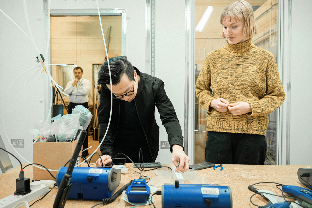 Engineers testing devices in the lab